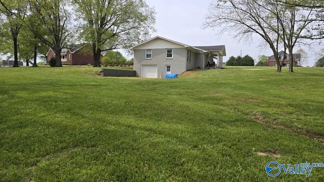 view of yard with a garage