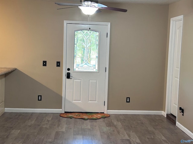 foyer entrance featuring ceiling fan and dark hardwood / wood-style floors