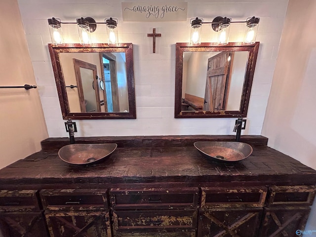 bathroom featuring vanity and backsplash