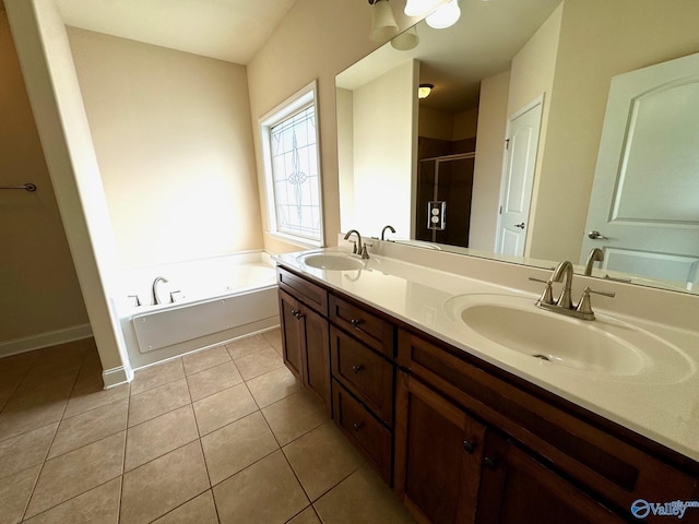 full bathroom featuring a bath, a stall shower, a sink, and tile patterned floors