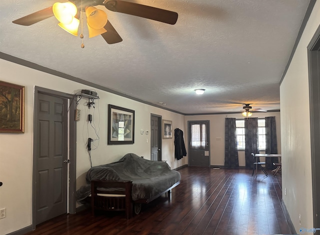 interior space with a textured ceiling and dark wood-type flooring