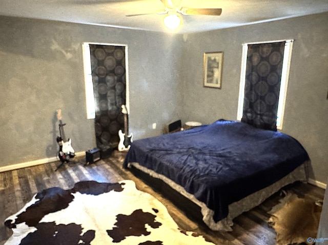 bedroom featuring ceiling fan and wood-type flooring