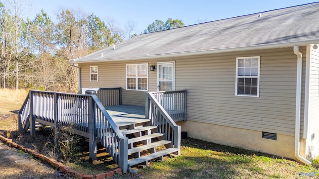 entrance to property featuring a wooden deck