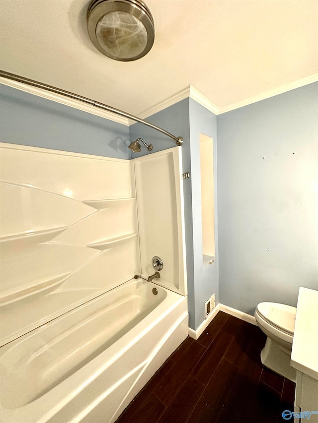 full bathroom with shower / bath combination, toilet, ornamental molding, hardwood / wood-style flooring, and vanity