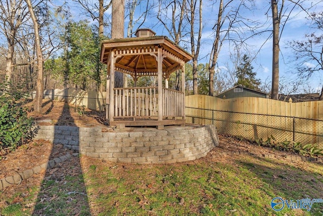 view of yard featuring a fenced backyard and a gazebo