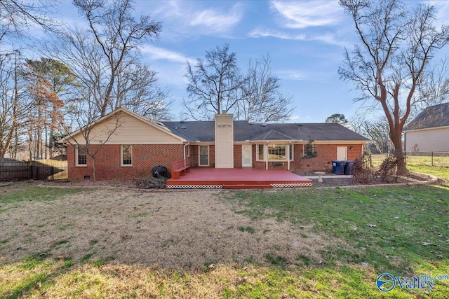 back of property featuring brick siding, fence, and a chimney