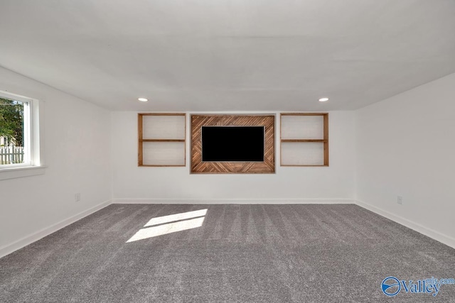 unfurnished living room featuring baseboards, carpet flooring, and recessed lighting