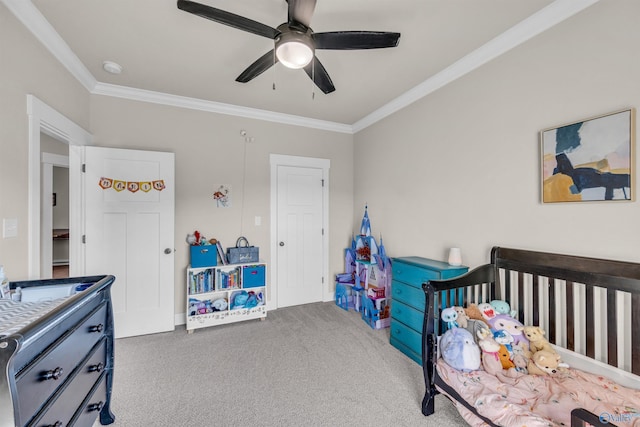 carpeted bedroom featuring ornamental molding and ceiling fan