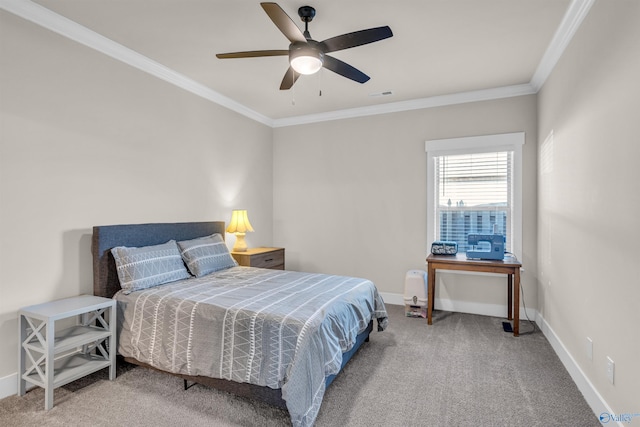 carpeted bedroom with ornamental molding and ceiling fan