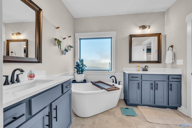 bathroom featuring vanity and a tub