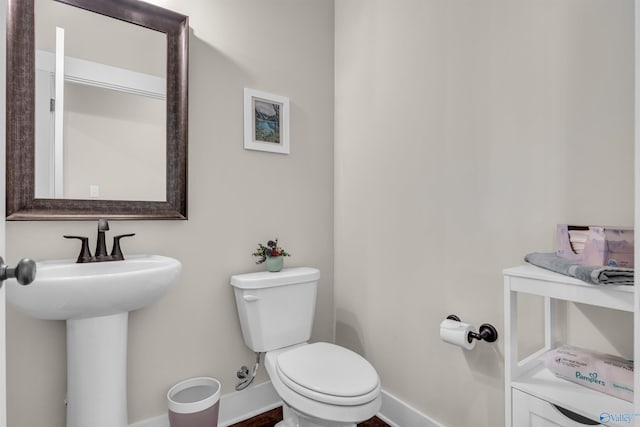 bathroom with sink and toilet