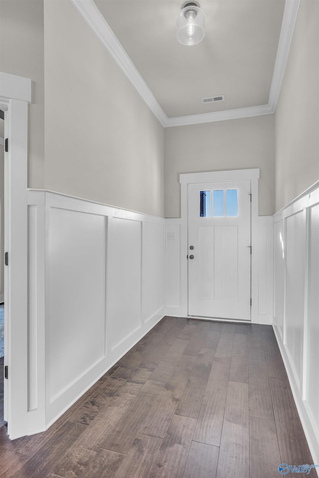 entryway with crown molding and dark wood-type flooring