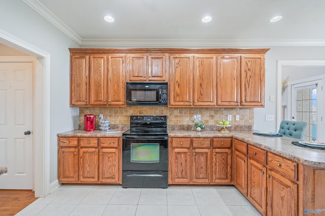 26409 Pepper Rd, Athens, AL 35613 - kitchen featuring decorative backsplash, black appliances, brown cabinetry, and crown molding