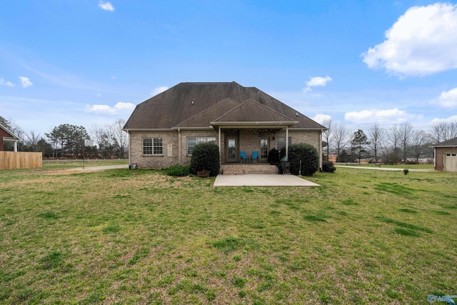 26409 Pepper Rd, Athens, AL 35613 - rear view of property with brick siding, a yard, and a patio area