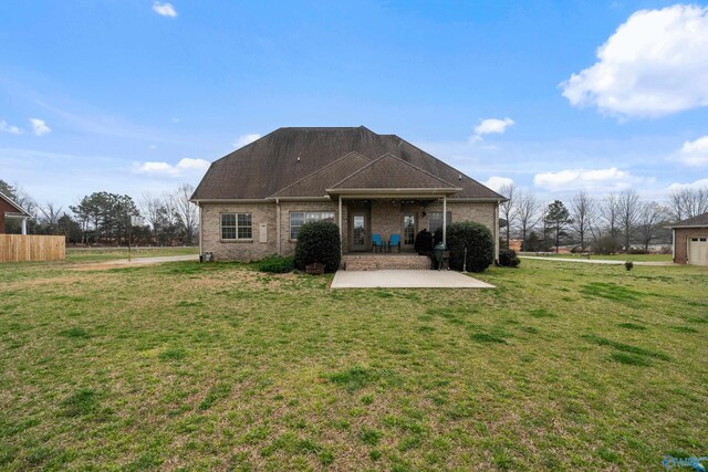 26409 Pepper Rd, Athens, AL 35613 - rear view of property with a lawn, a patio area, and brick siding