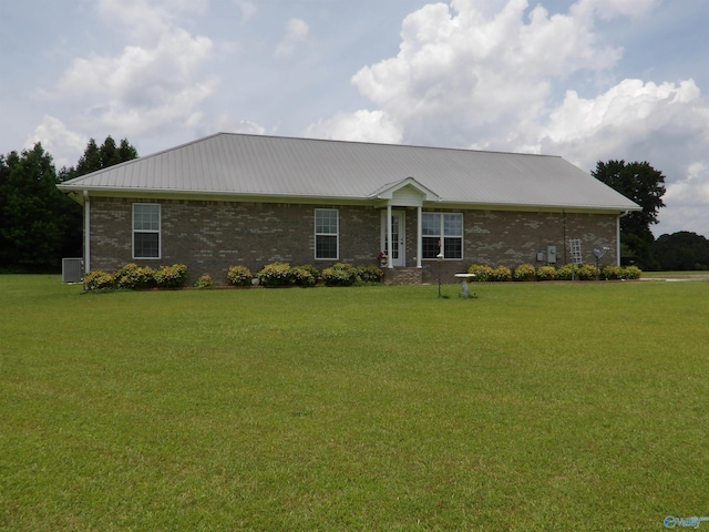 784 County Road 33, Fyffe, AL 35971 - ranch-style home with a front yard, metal roof, central air condition unit, and brick siding