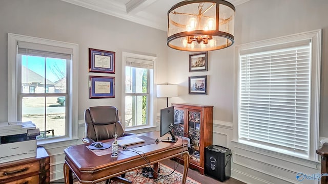 office featuring a decorative wall, a wainscoted wall, beamed ceiling, and crown molding