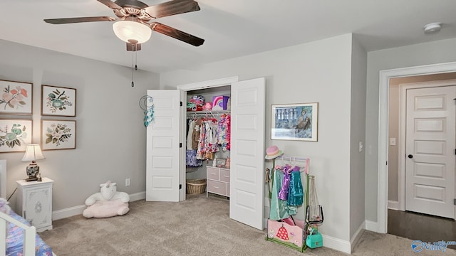 bedroom featuring baseboards, a closet, and carpet floors