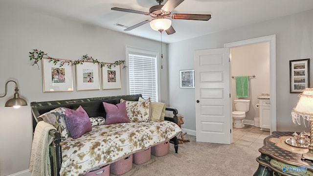 living room with light tile patterned floors, baseboards, visible vents, ceiling fan, and light carpet