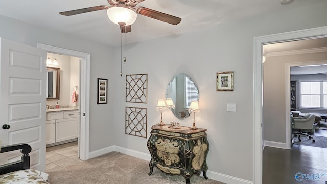 interior space with light carpet, baseboards, and ornamental molding