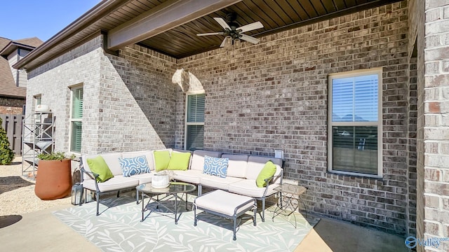 view of patio with an outdoor living space and ceiling fan