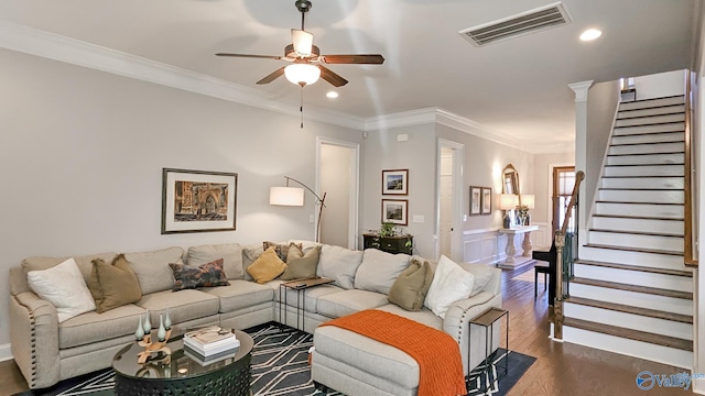 living area featuring visible vents, crown molding, dark wood-type flooring, stairs, and recessed lighting