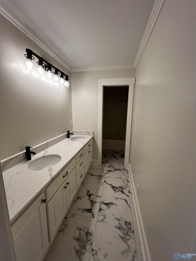 bathroom featuring vanity, a textured ceiling, and ornamental molding