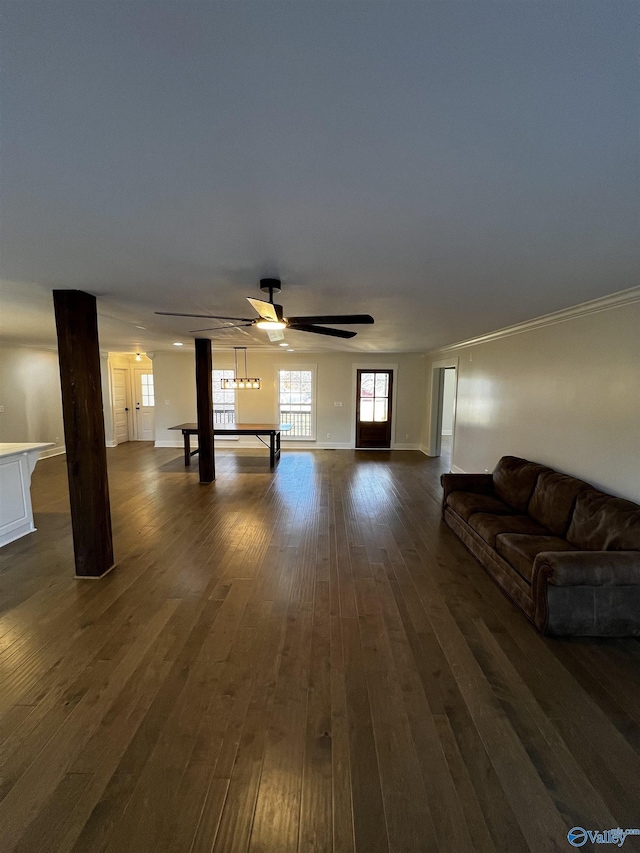 unfurnished living room with dark hardwood / wood-style floors and ceiling fan