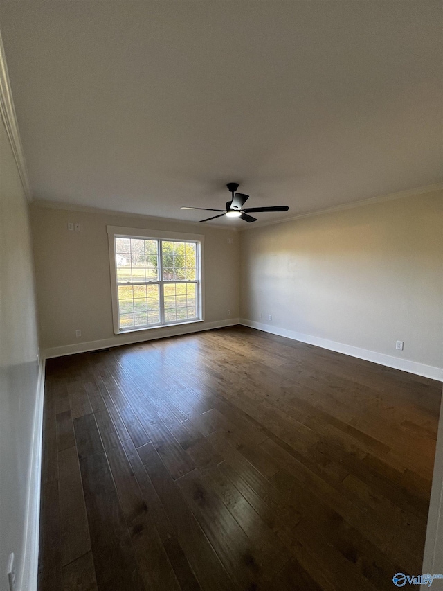 unfurnished room featuring dark hardwood / wood-style flooring, ceiling fan, and crown molding