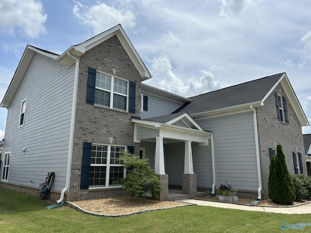 4359 Willow Bend Ln SE, Owens Cross Roads, AL 35763 - craftsman-style home with covered porch, brick siding, and a front lawn