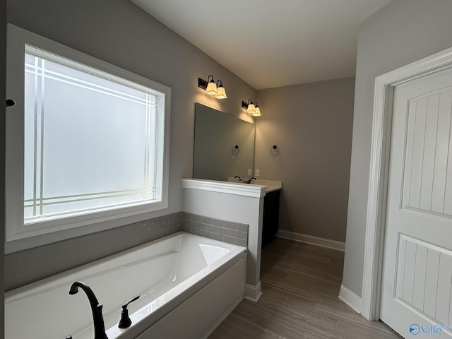 4359 Willow Bend Ln SE, Owens Cross Roads, AL 35763 - full bathroom featuring a bath, vanity, and wood finished floors