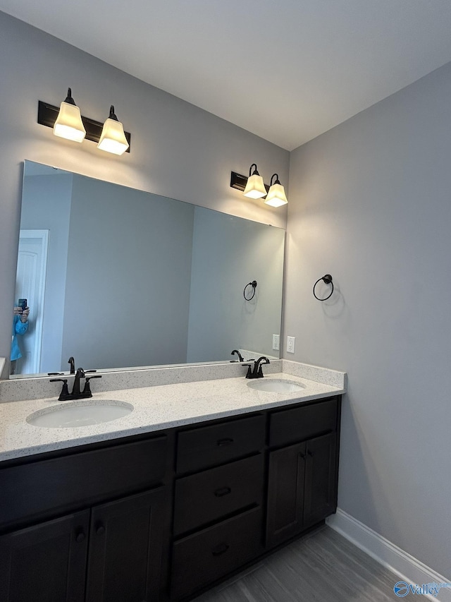 4359 Willow Bend Ln SE, Owens Cross Roads, AL 35763 - bathroom with double vanity and wood finished floors