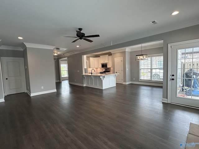 4359 Willow Bend Ln SE, Owens Cross Roads, AL 35763 - unfurnished living room featuring ornamental molding, dark wood-type flooring, a ceiling fan, recessed lighting, and a chandelier