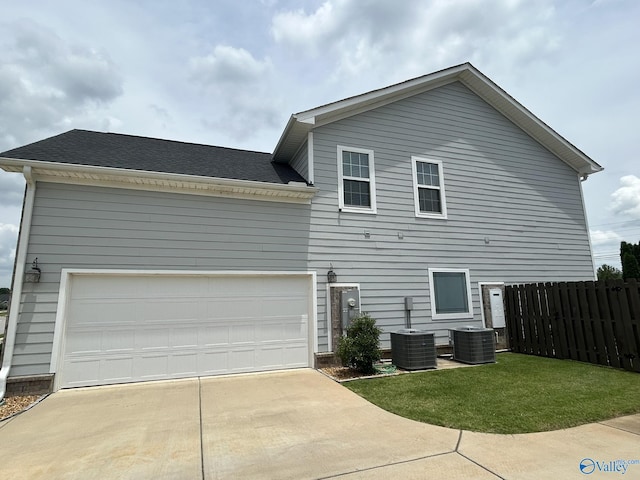 4359 Willow Bend Ln SE, Owens Cross Roads, AL 35763 - rear view of property with driveway, roof with shingles, and an attached garage
