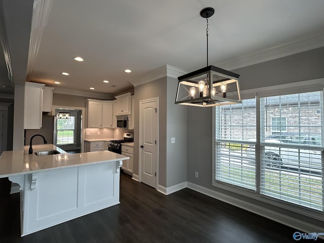 4359 Willow Bend Ln SE, Owens Cross Roads, AL 35763 - kitchen featuring appliances with stainless steel finishes, crown molding, a peninsula, light countertops, and dark wood-type flooring