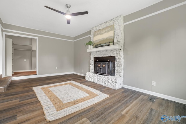 2017 Shady Lane Dr, Huntsville, AL 35810 - unfurnished living room featuring a stone fireplace, dark hardwood / wood-style floors, and ceiling fan