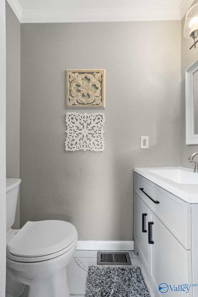 2017 Shady Lane Dr, Huntsville, AL 35810 - bathroom with ornamental molding, vanity, and toilet