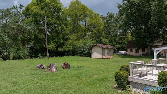 2017 Shady Lane Dr, Huntsville, AL 35810 - view of yard with a wooden deck and a storage shed