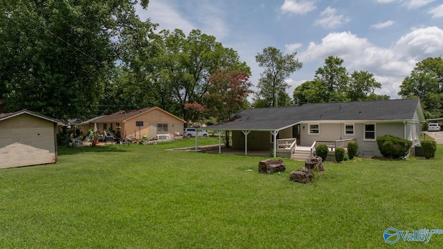 2017 Shady Lane Dr, Huntsville, AL 35810 - back of house featuring a storage shed and a lawn