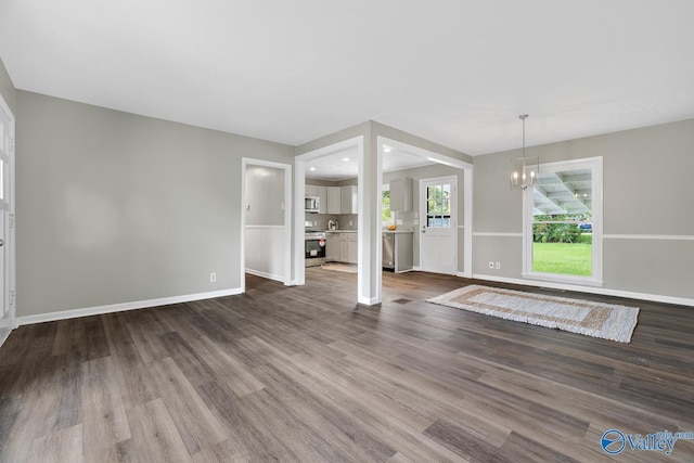2017 Shady Lane Dr, Huntsville, AL 35810 - unfurnished living room featuring hardwood / wood-style flooring and a chandelier