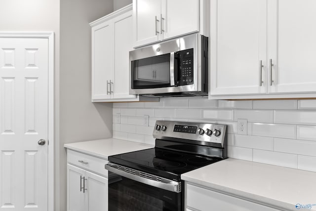 laundry area featuring hardwood / wood-style flooring, electric dryer hookup, and hookup for a washing machine