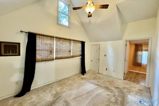 additional living space featuring carpet flooring, high vaulted ceiling, and ceiling fan