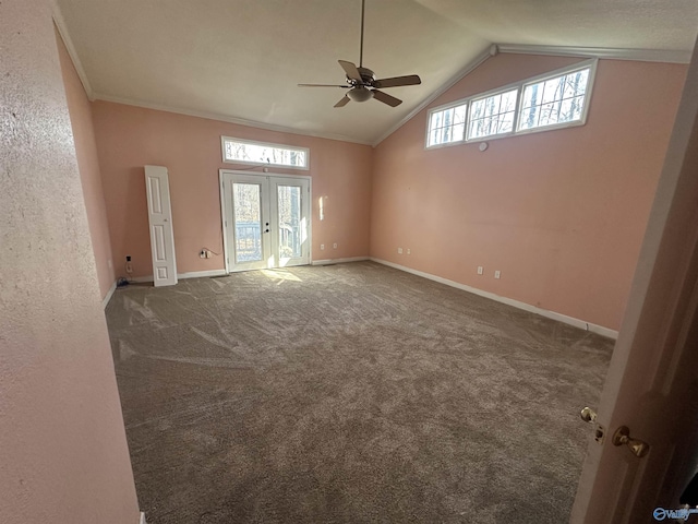 empty room featuring high vaulted ceiling, a wealth of natural light, french doors, and carpet flooring