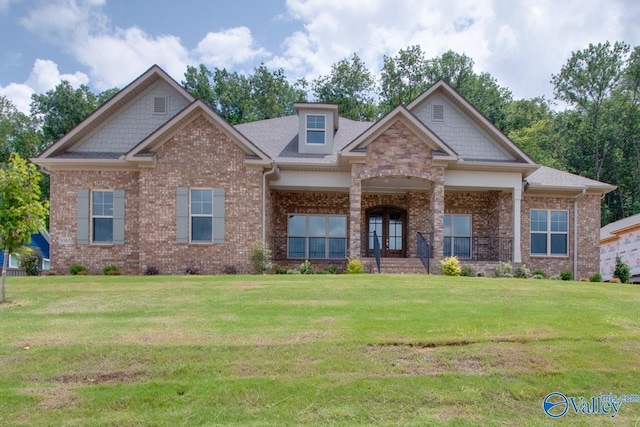 craftsman-style home with a front yard