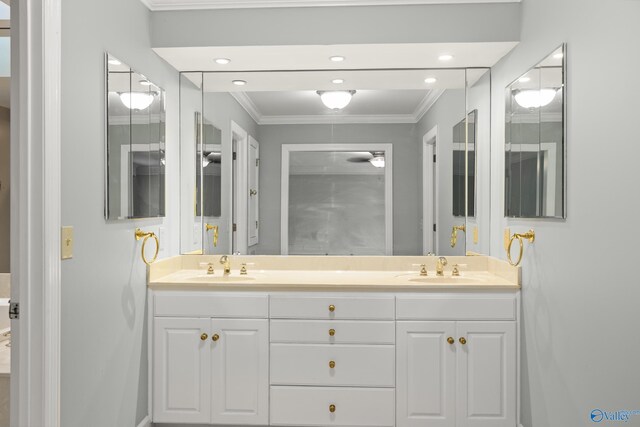 bathroom with vanity and ornamental molding