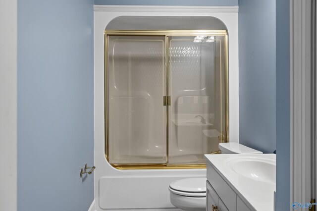 full bathroom featuring shower / bath combination with glass door, toilet, and vanity