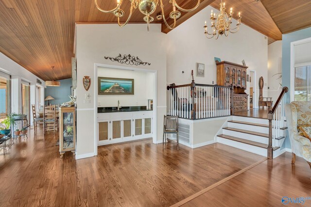411 Darby Ave, Sheffield, AL 35660 - interior space with wooden ceiling, a notable chandelier, and wood finished floors