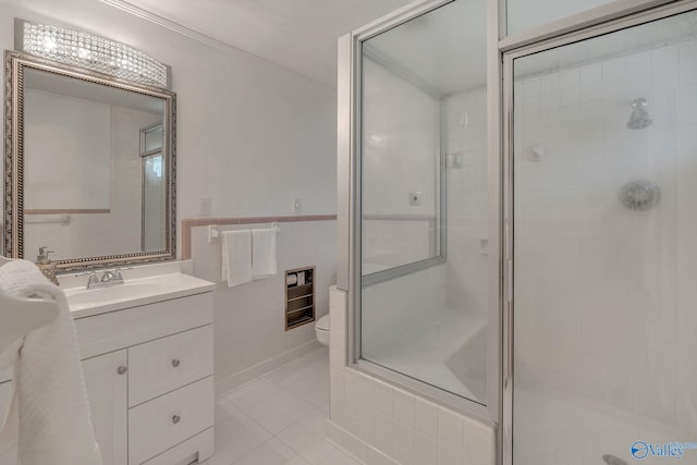 411 Darby Ave, Sheffield, AL 35660 - full bathroom with a stall shower, tile patterned floors, toilet, vanity, and tile walls
