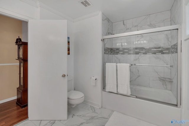411 Darby Ave, Sheffield, AL 35660 - full bathroom featuring visible vents, crown molding, marble finish floor, combined bath / shower with glass door, and toilet