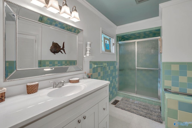411 Darby Ave, Sheffield, AL 35660 - bathroom with a stall shower, crown molding, vanity, and tile walls